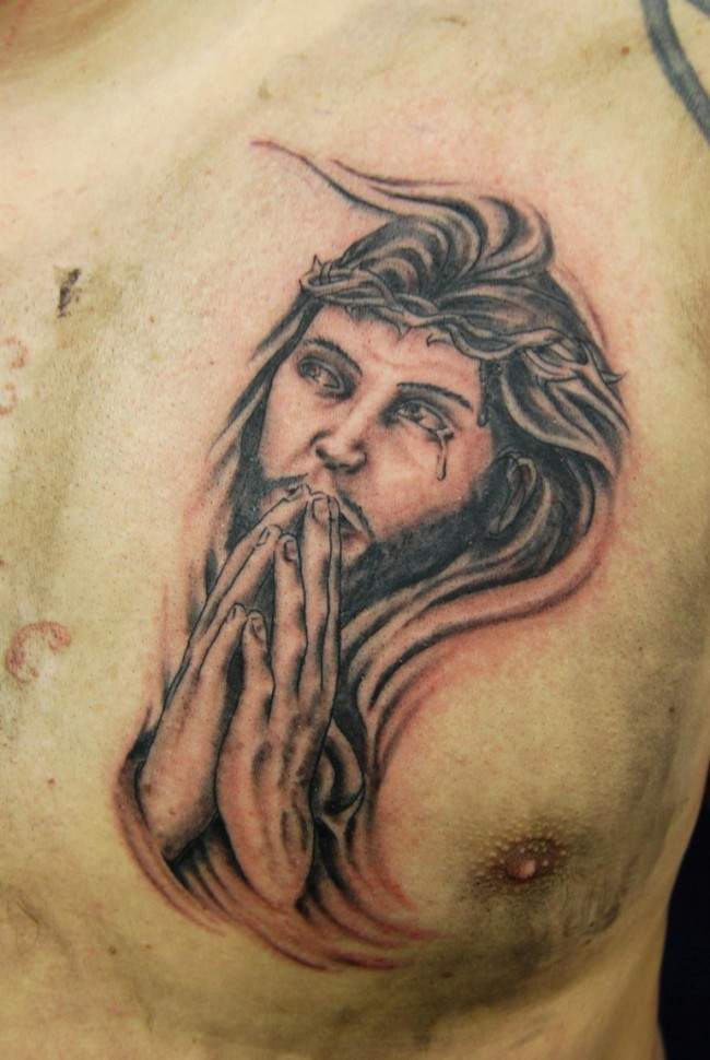 ripped-skin-praying-jesus-tattoo-on-chest
