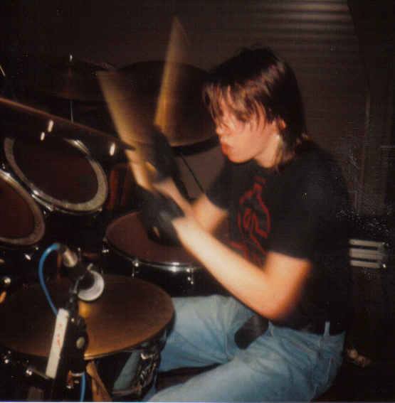 Chris drumming with Oi Polloi in 1987