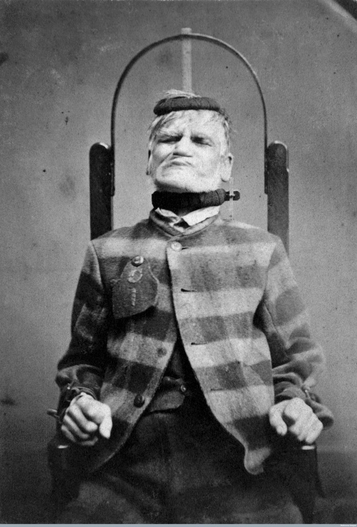L0019069 Man in restraint chair; by H. Clarke; 1869