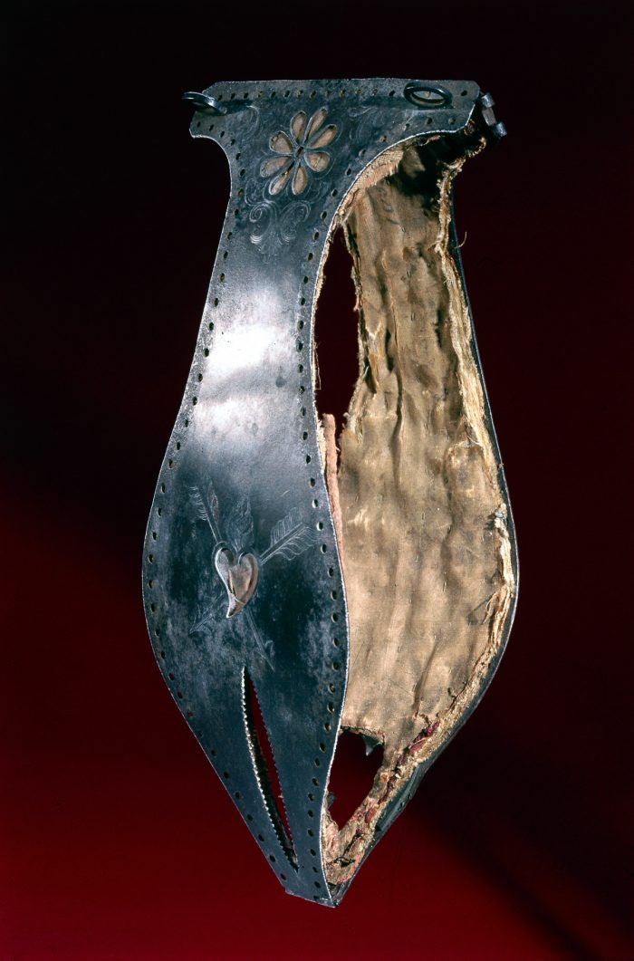 UNITED KINGDOM - NOVEMBER 22:  Chastity belt decorated with a flower design and a heart pierced with arrows. Chastity belts originated in the 15th century. They were devices designed to prevent the female wearer from having sexual intercourse, and incorporated openings to facilitate urination and defecation. They were locked to prevent their removal.  (Photo by SSPL/Getty Images)