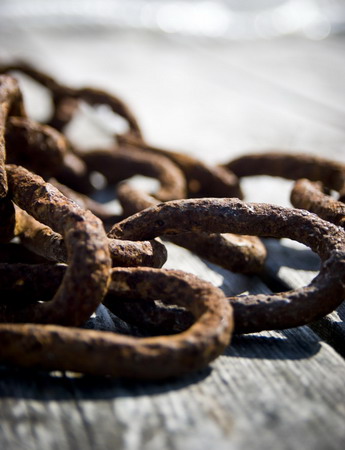 25 May 2006, Sweden --- Close-up of rusty chain on jetty --- Image by © Ellinor Hall/Johnér Images/Corbis