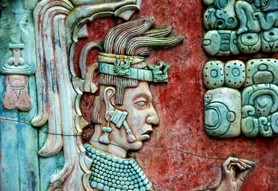 Lord K'inich Janaab' Pakal seen wearing jade ear spools on this base relief at Palenque. 